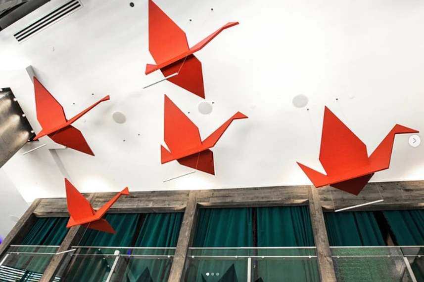 Foam origami cranes suspended above Imoto