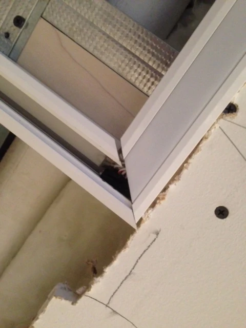 Original field condition showing failed miter and wiring