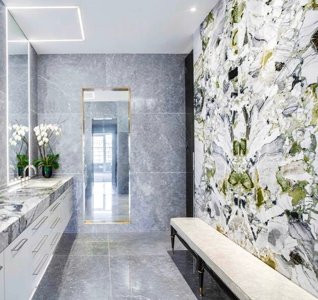 Finished Residence at the W with continuous linear lighting across mirror and ceiling